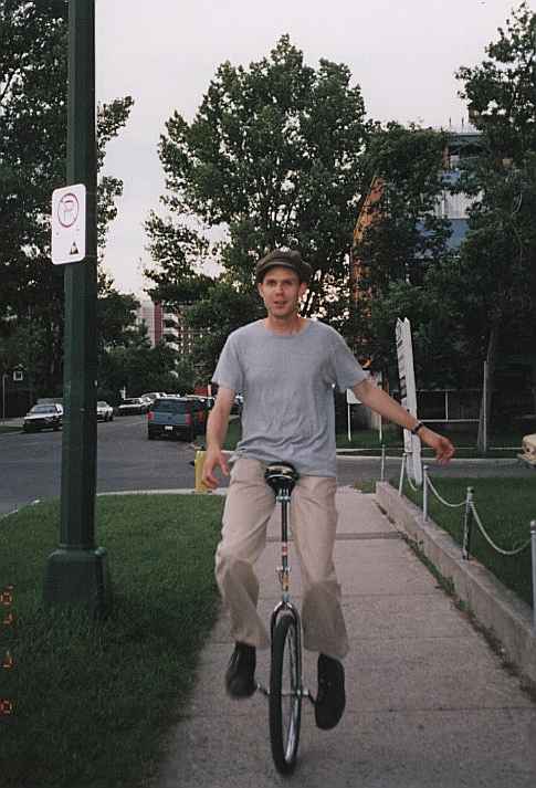 me, riding down 11th Street west on my 24 inch wheel
